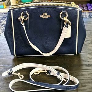 Navy blue coach hand bag with shoulder strap
